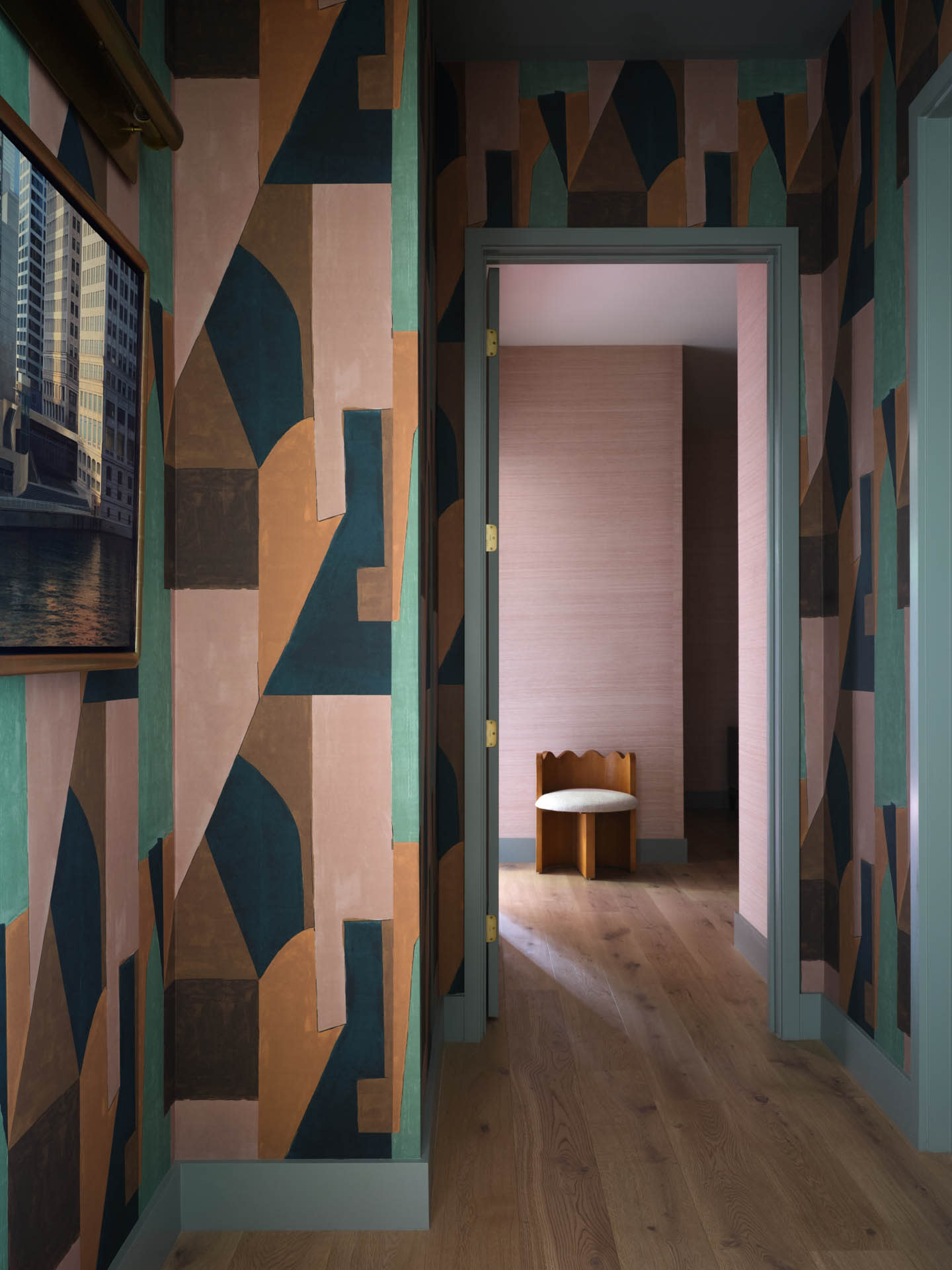 hallway with graphic wallpaper and pink room beyond