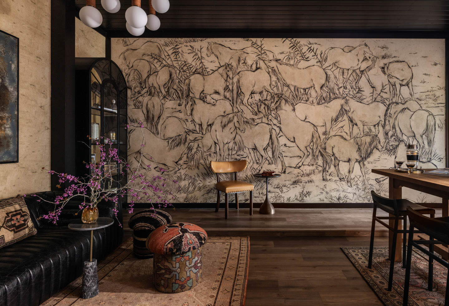 moody lounge with a cattle-motif mural