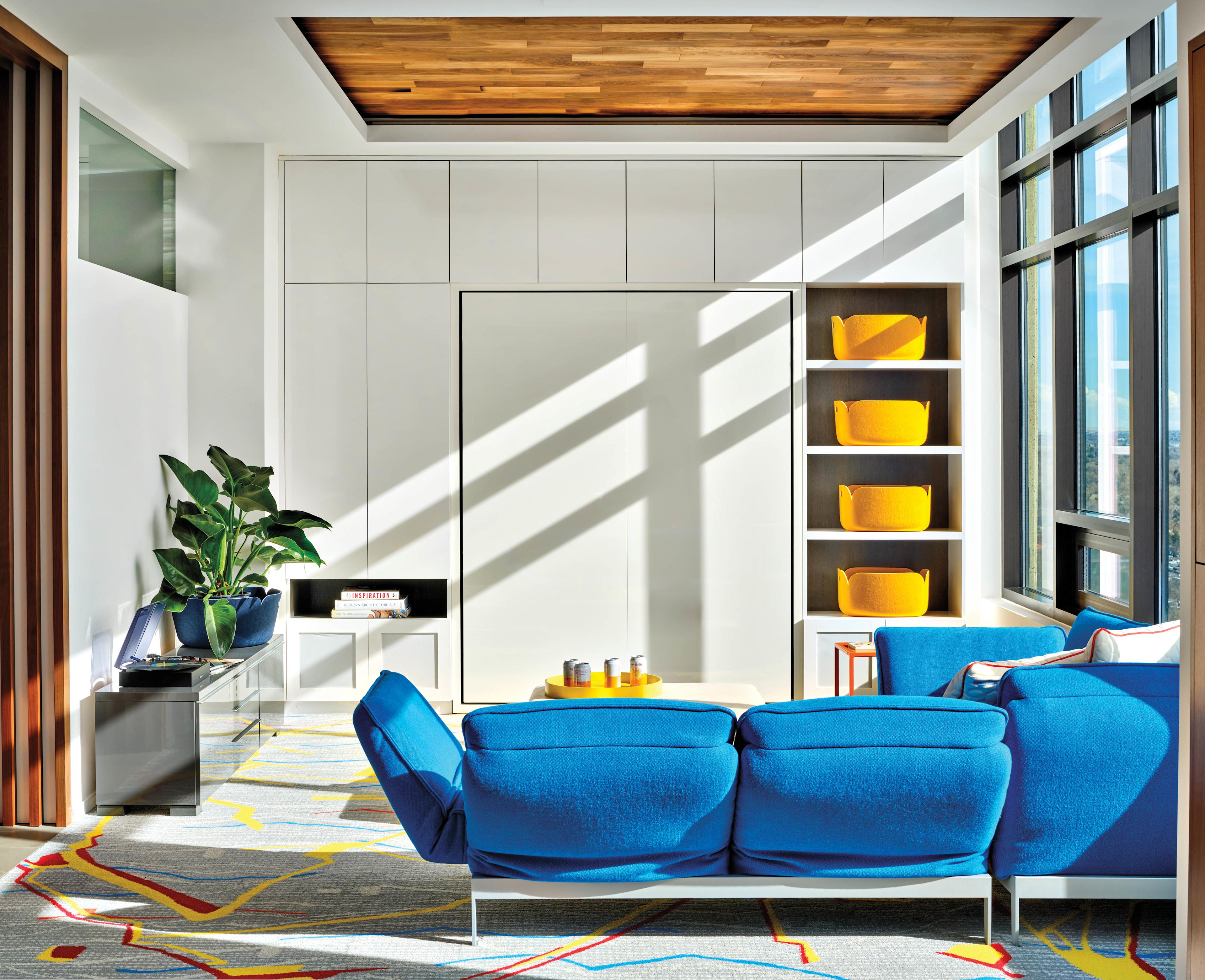 family room with a bright blue couch 